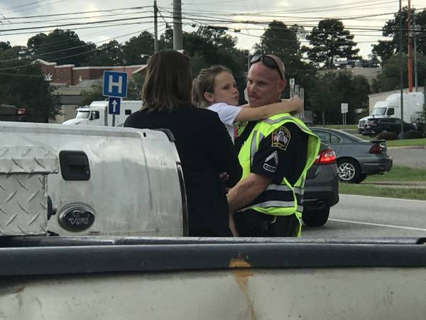 Dothan Corporal Cade Wells Takes Care Of A Child At A Accident