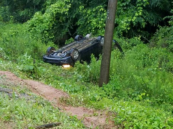 2:55 PM... Vehicle Overturned in the Ditch on Omussee Road