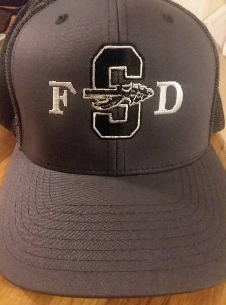 Slocomb Fire Designs New Caps To Support School