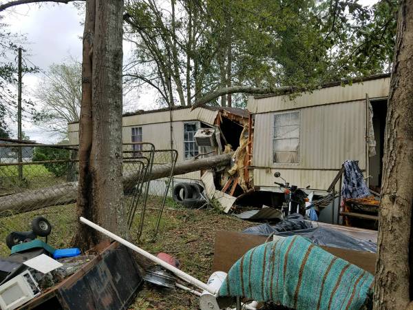 Volunteers and First Responders in Houston County Work to clear Roads