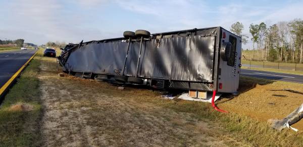 TRAILER FLIPPED AFTER RUNNING OFF ROADWAY