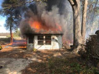11:18 AM.. Outdoor Fire Turned Structure (Shed) Fire