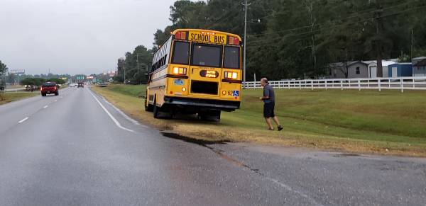7:05 AM.  Moving Van verse School Bus on South Oates