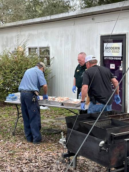 Holmes County Sheriff Prepare food for the Holmes Council